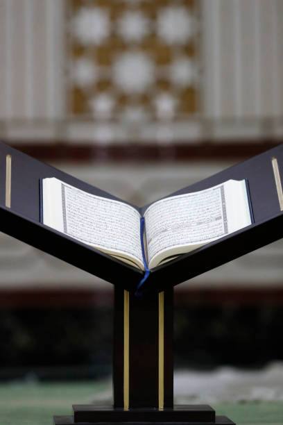 Family reading Quran together in golden light